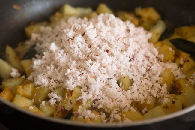 fresh grated coconut added to ash gourd thoran in the pan. 