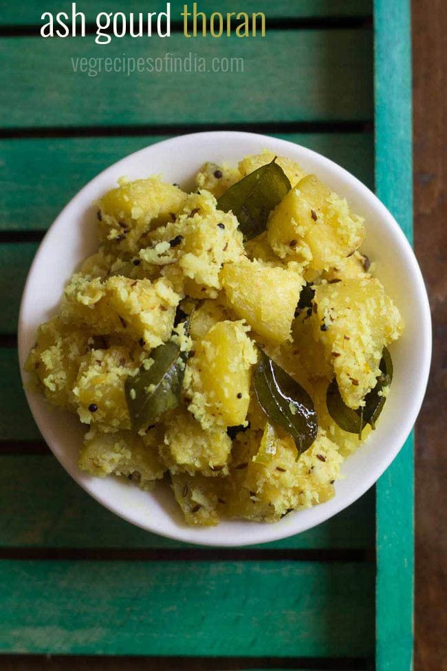 ash gourd thoran served in a white bowl.