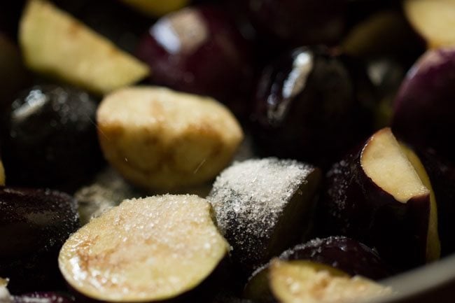 salt added to eggplant in pan.