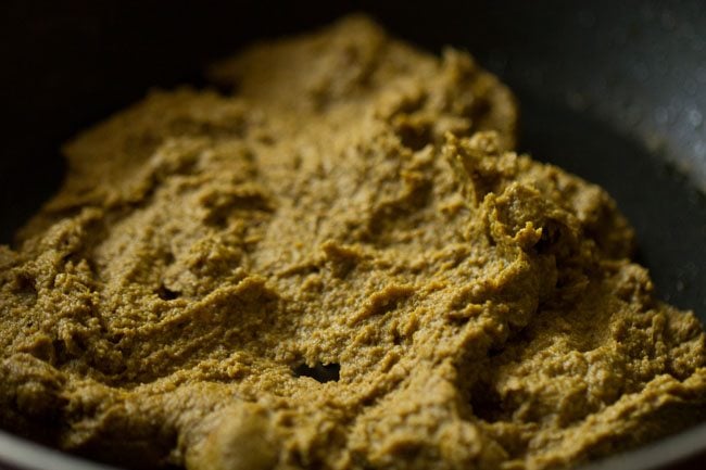 masala paste has darkened and thickened after cooking.