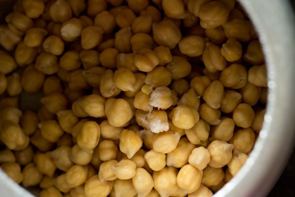 chickpeas added to pressure cooker with salt