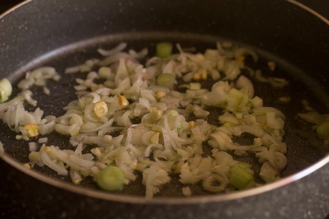 sauteing the spring onions