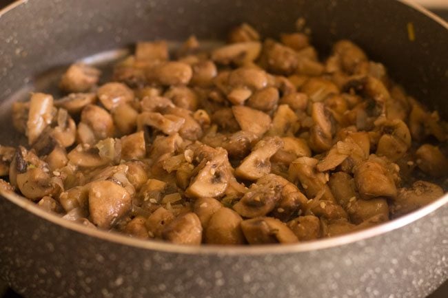 mixing herbs spices with mushroom