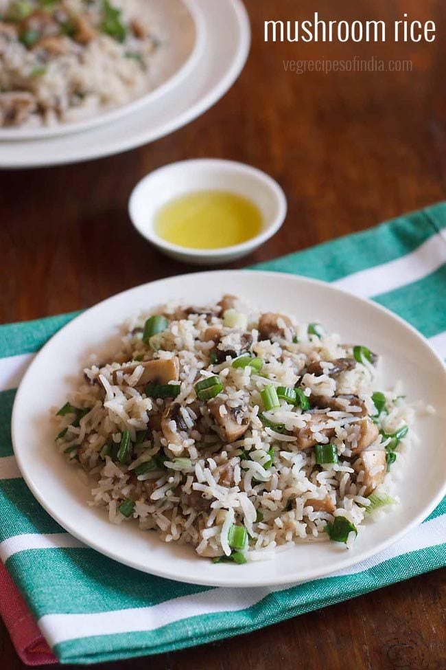 mushroom rice served on a white plate.