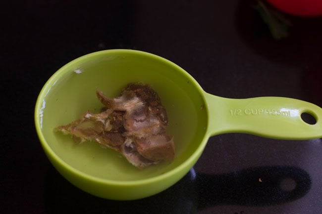 soaked tamarind in a small bowl