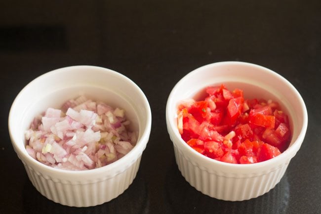 chopped onions and tomatoes in separate bowls