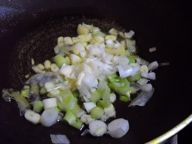 scallions and garlic in oil in a pan