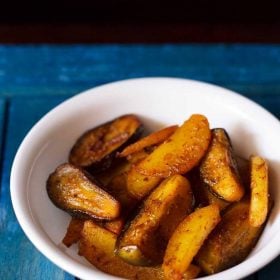 aloo baingan sabji served in a white bowl