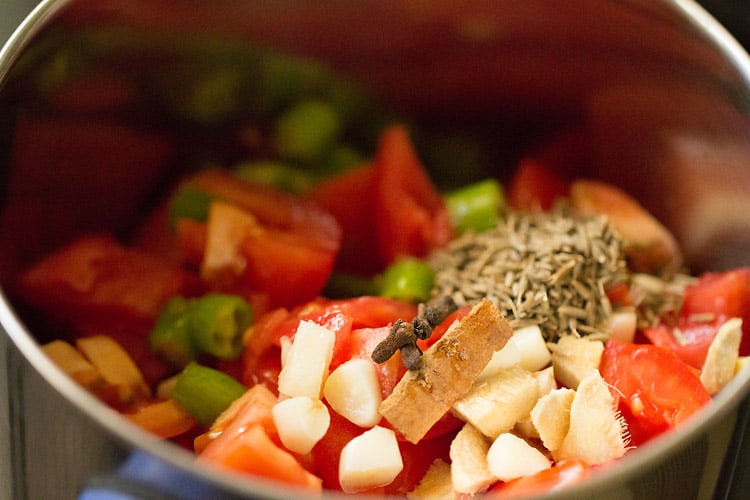 various herbs and spices added to grinder jar