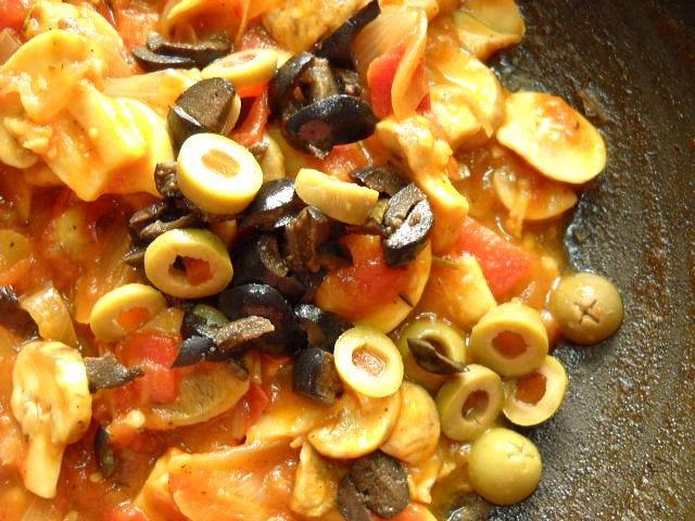 sliced olives added to the tomato mushroom sauce. 