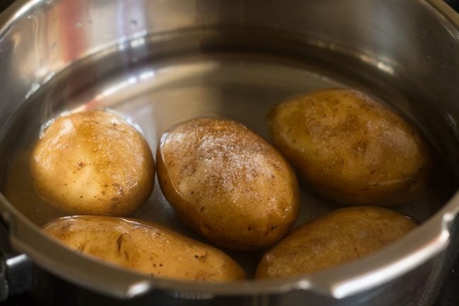 potatoes in a pressure cooker with salt added