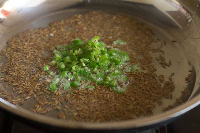 add green chillies to the fried cumin