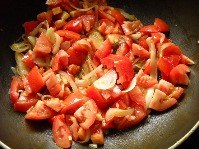 chopped tomatoes added to the pan. 