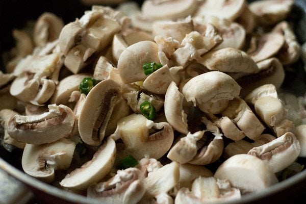 chopped mushrooms and chopped green chilies added to pan. 