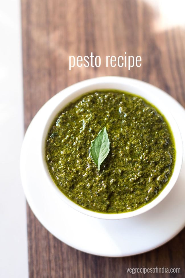 pesto sauce in a white bowl with white text layovers.