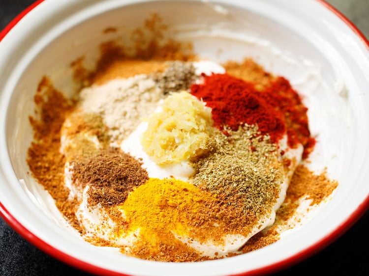 spice powders and ginger-garlic paste added to hung curd