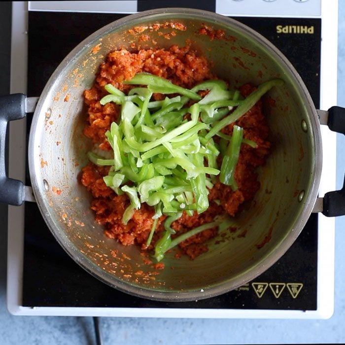 thin capsicum slices added to tomato masala