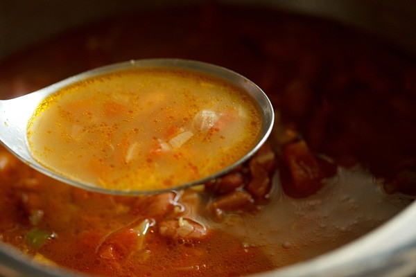 rajma masala broth in spoon