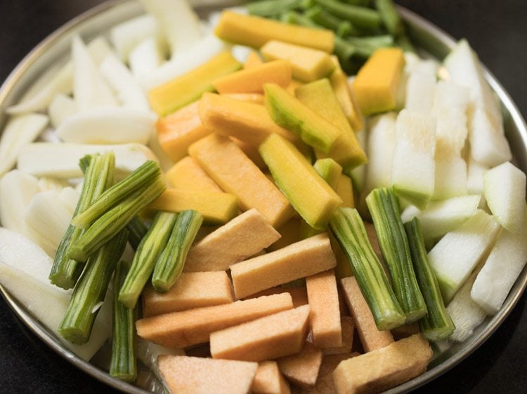 peeled and chopped vegetables on a plate