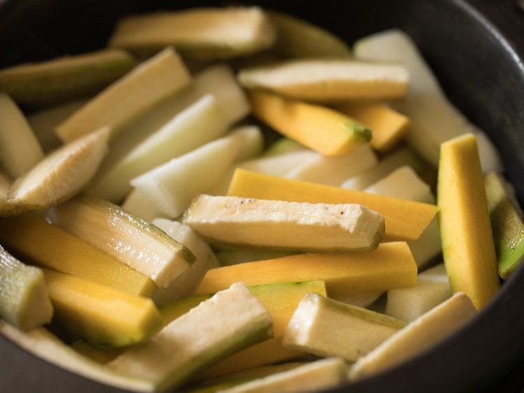 adding remaining veggies to pan