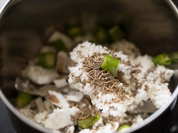 making coconut paste in a grinder