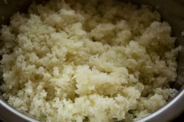 grated cauliflower in a bowl.