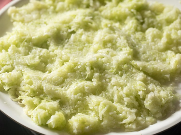 peeled and grated lauki in a white plate