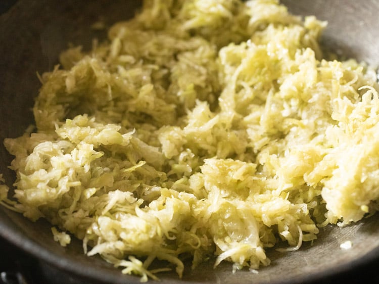 grated lauki added to ghee in pan
