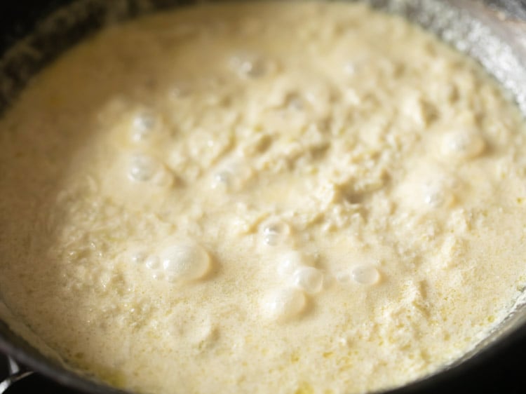 Cook till ¾ or 75% of the milk has reduced and absorbed