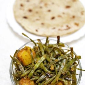 sautéed radish pods and potatoes in a glass bowl.