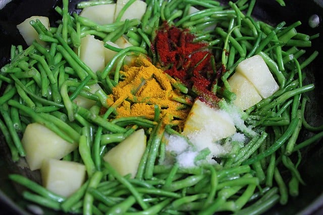 turmeric powder, red chili powder and salt added to the vegetables. 