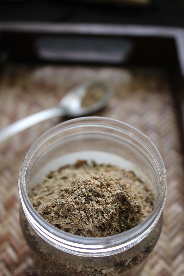 dry masala tea powder in a mason jar.