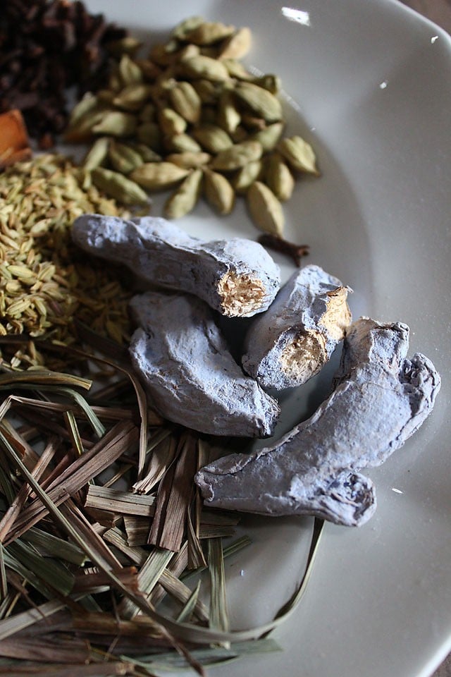 closeup of dry ginger - it looks pale blue with a tan interior.