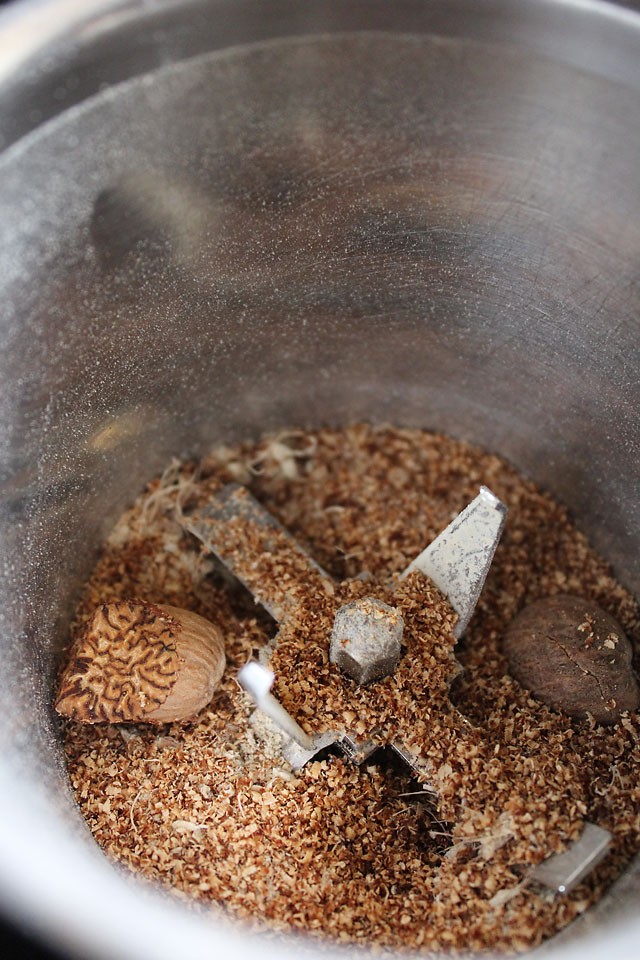 grinding nutmeg in a spice grinder.