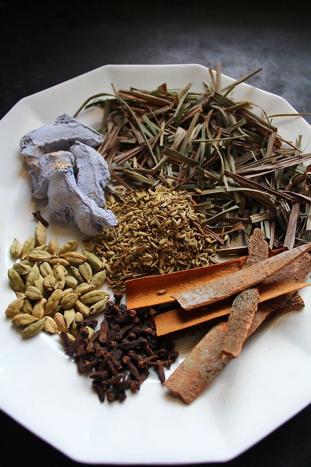 whole spices for making masala tea blend - cardamom, dry ginger, lemongrass, fennel, cloves, and cinnamon.