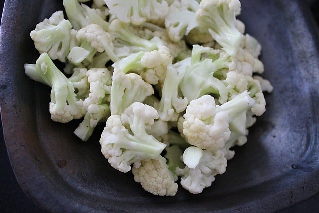 blanched cauliflower added to pan.