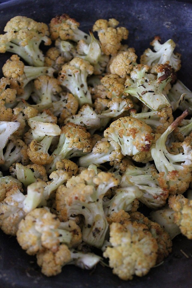 baked cauliflower on a baking sheet straight from the oven. 