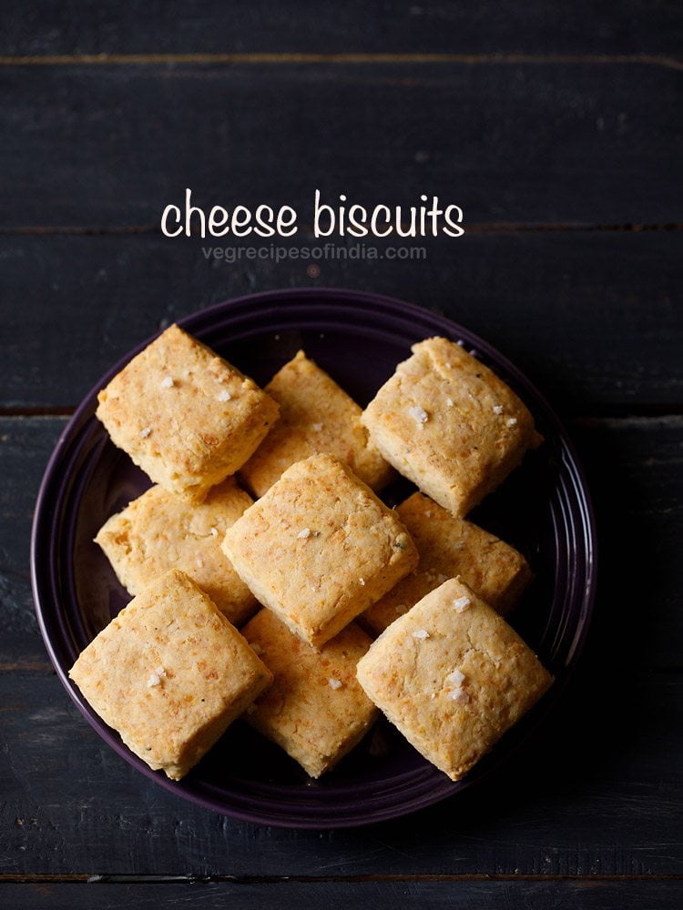 cheese biscuits served in a black bowl with text layover.