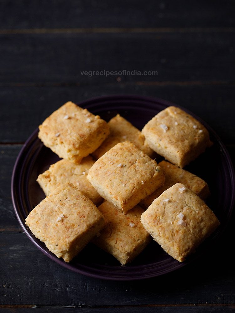 cheese biscuits served on a black plate