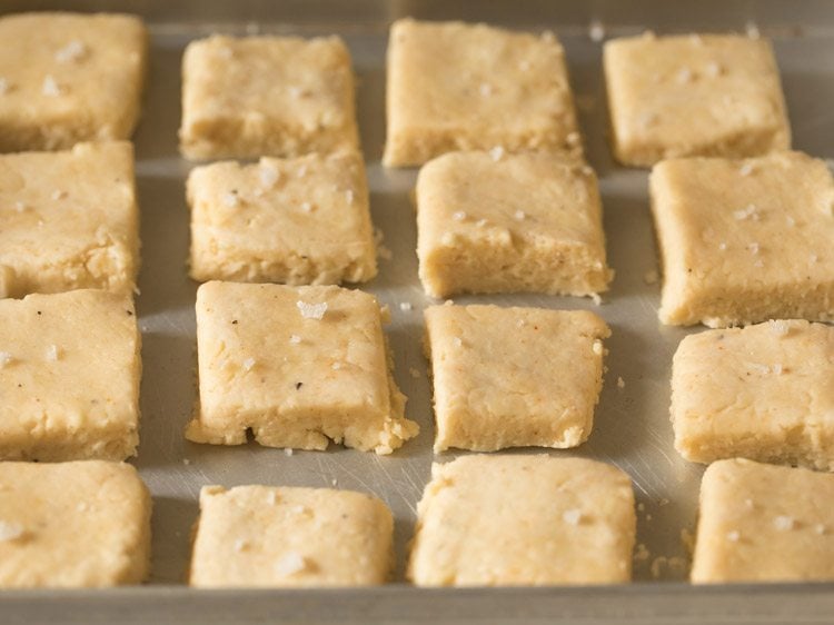 cheese biscuits placed on greased baking tray