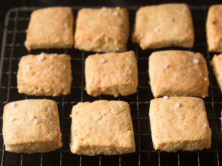 baked cheese biscuits placed on wire rack