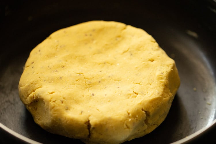 smooth cornmeal dough in black bowl