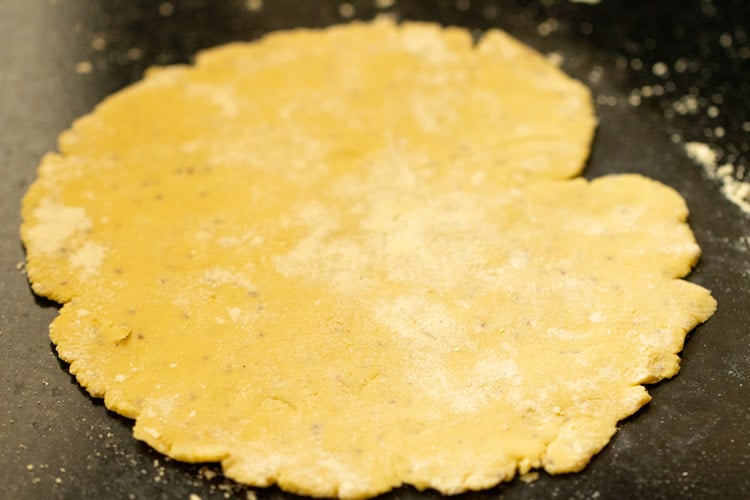 flattened makki ki roti on black work surface