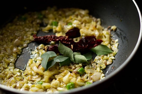 curry leaves and dried red chillies added