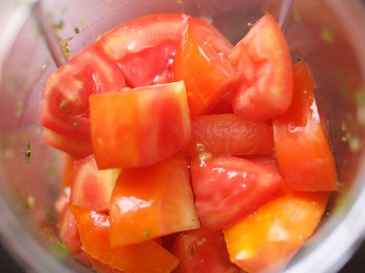 chopped tomatoes in a blender