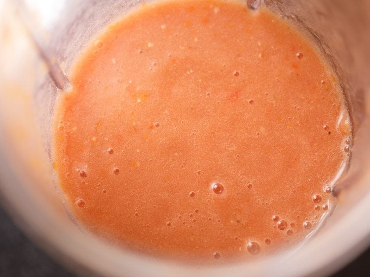 tomatoes blended to a smooth puree to make tomato rasam