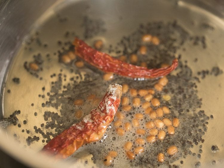 dry red chillies and asafoetida added in the pan