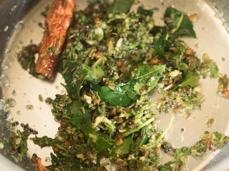 sautéing curry leaves, spices and herbs mixture