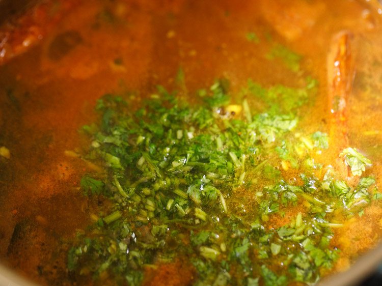 chopped coriander leaves added to tomato rasam