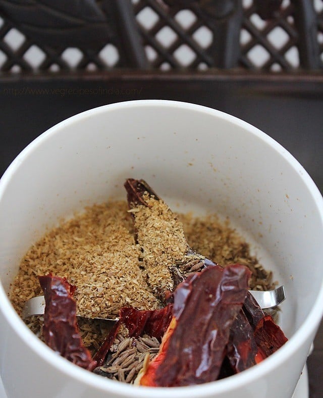 spices for dabeli masala in a dry grinder. 